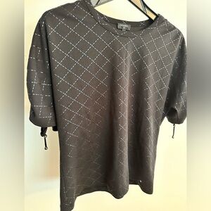 Chanel black top. New and in excellent condition. Size 38.